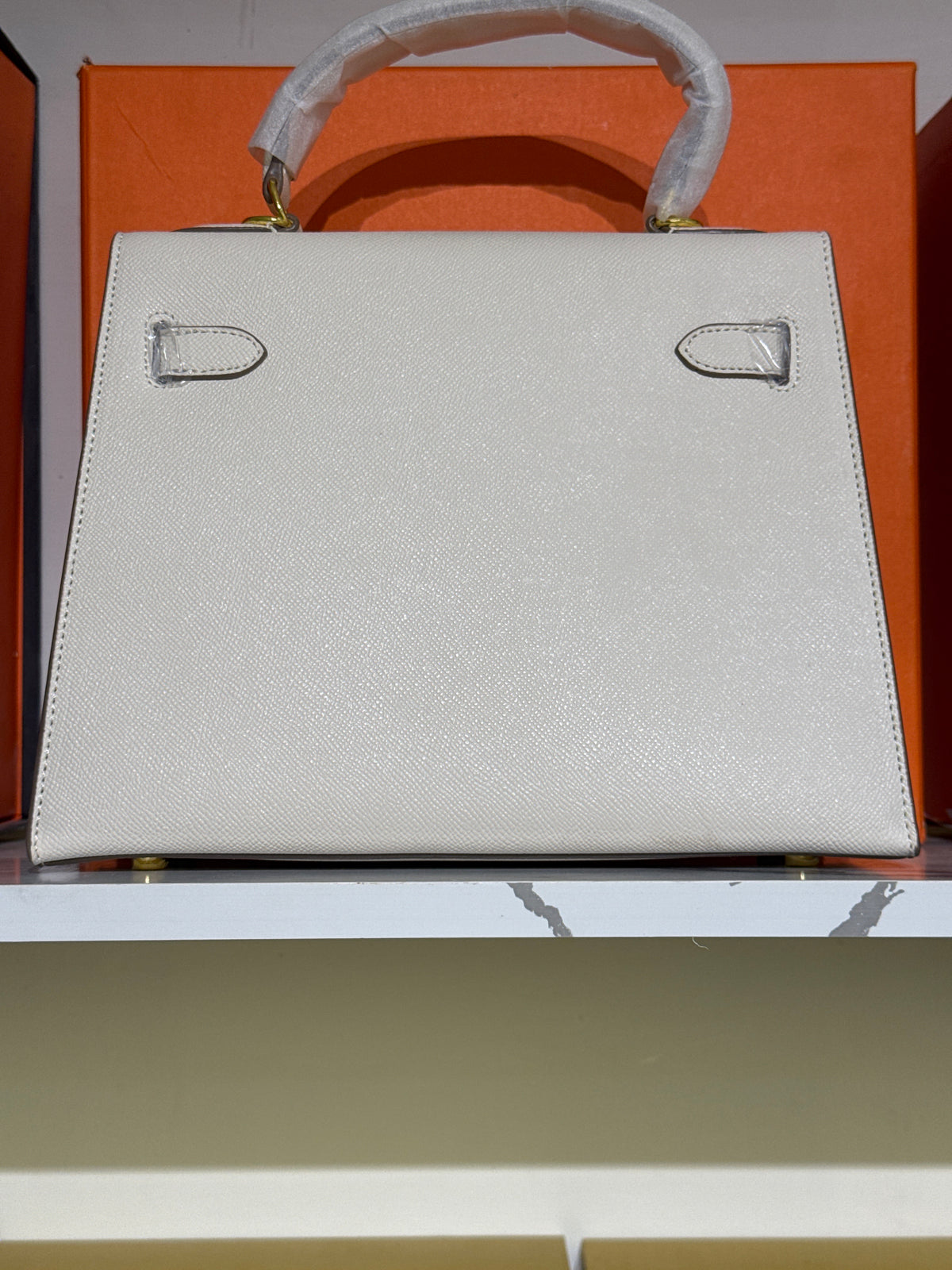 Off-White Leather Top-Handle Structured Handbag with Gold-Tone Lock Accent