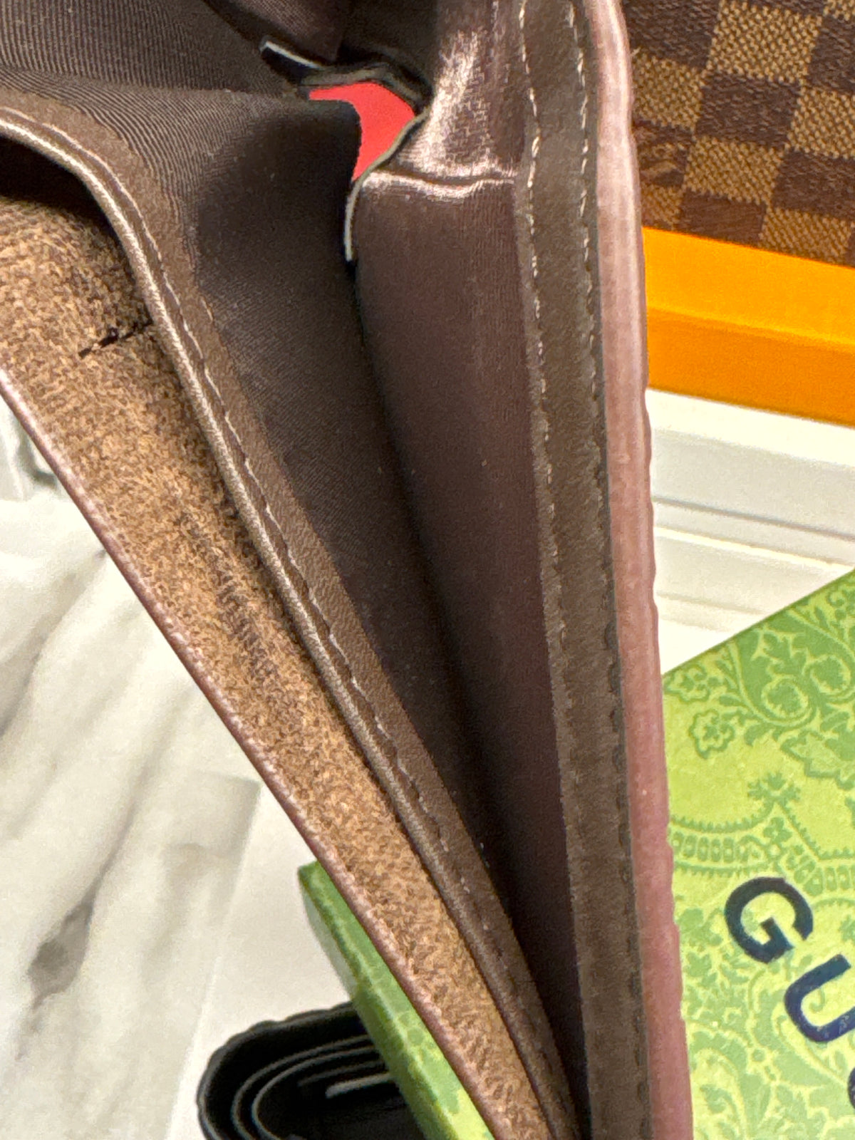 Dark Brown Embossed Monogram Leather Bifold Wallet with Silver Accent