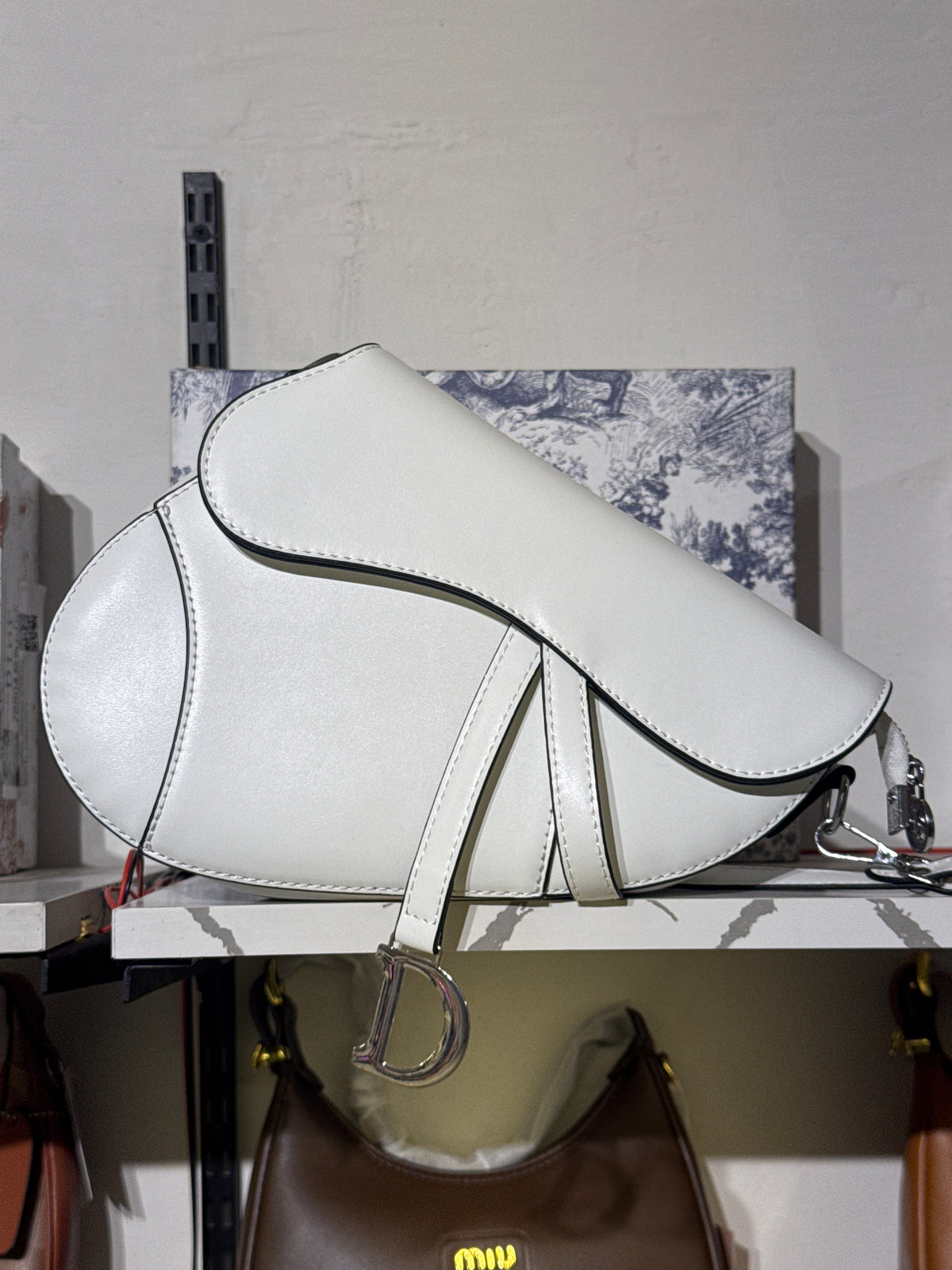 White Leather Saddle Shoulder Bag with Silver-Tone D Charm Accent