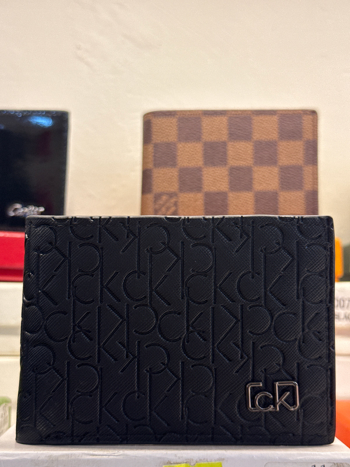Black Embossed Monogram Leather Bifold Wallet with Gunmetal Plaque
