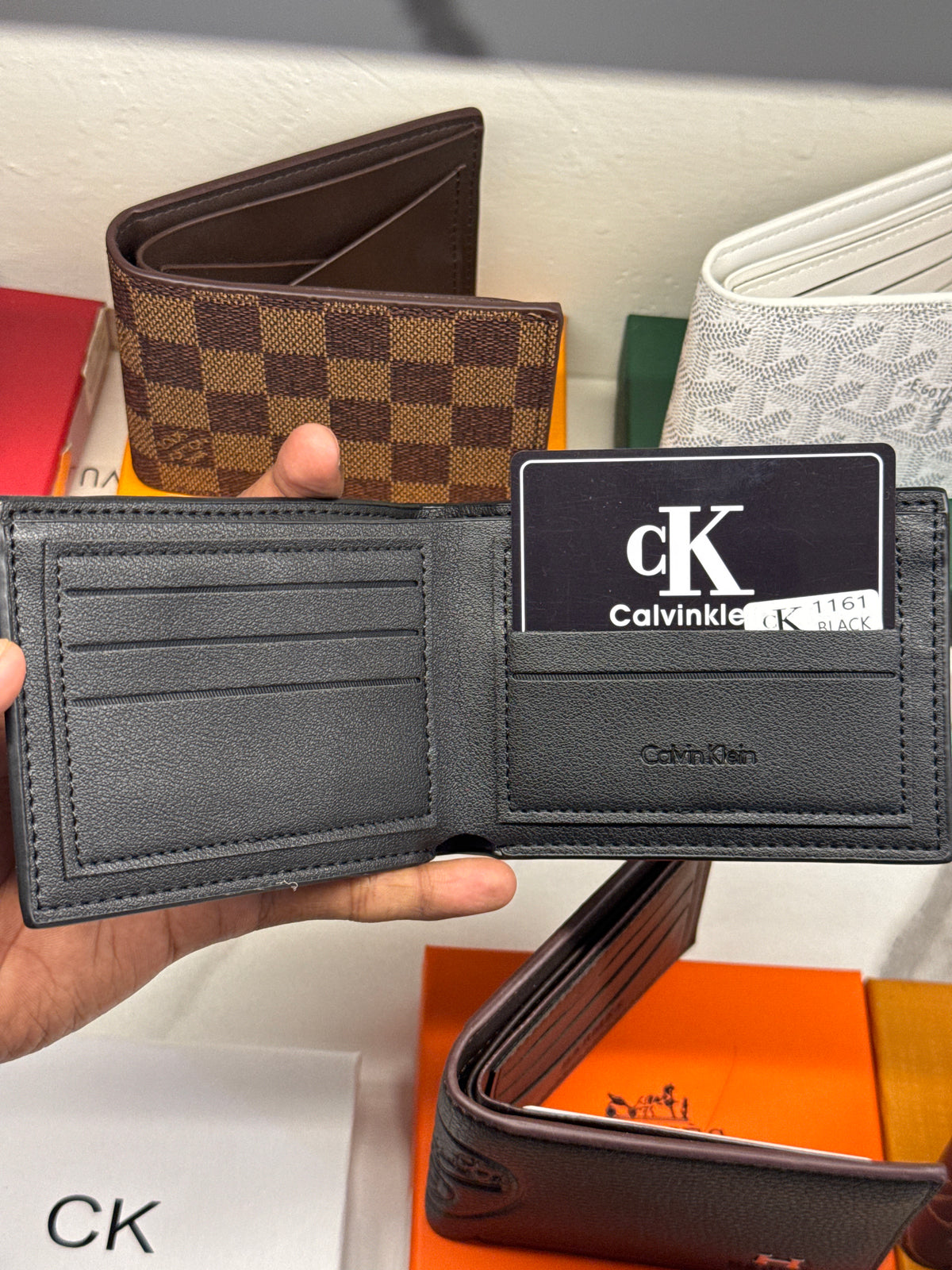 Black Embossed Monogram Leather Bifold Wallet with Gunmetal Plaque
