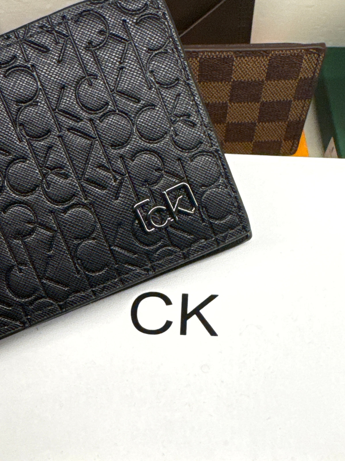 Black Embossed Monogram Leather Bifold Wallet with Gunmetal Plaque