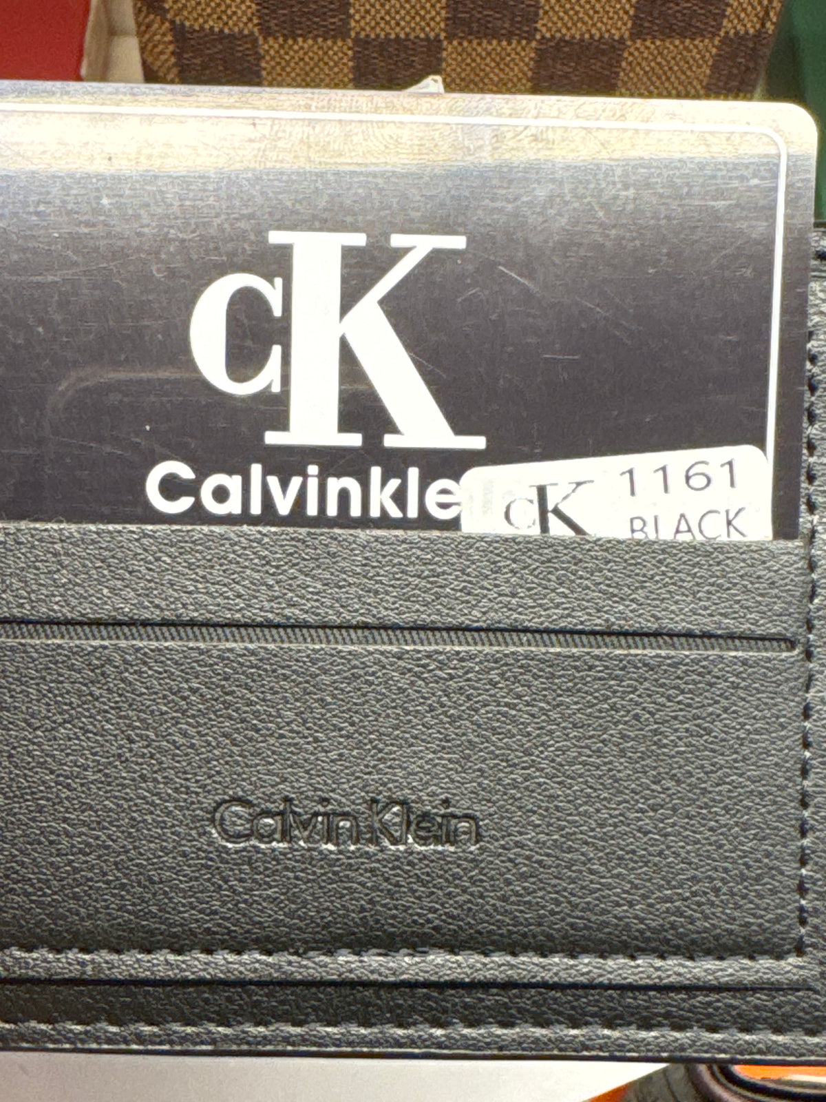 Black Embossed Monogram Leather Bifold Wallet with Gunmetal Plaque