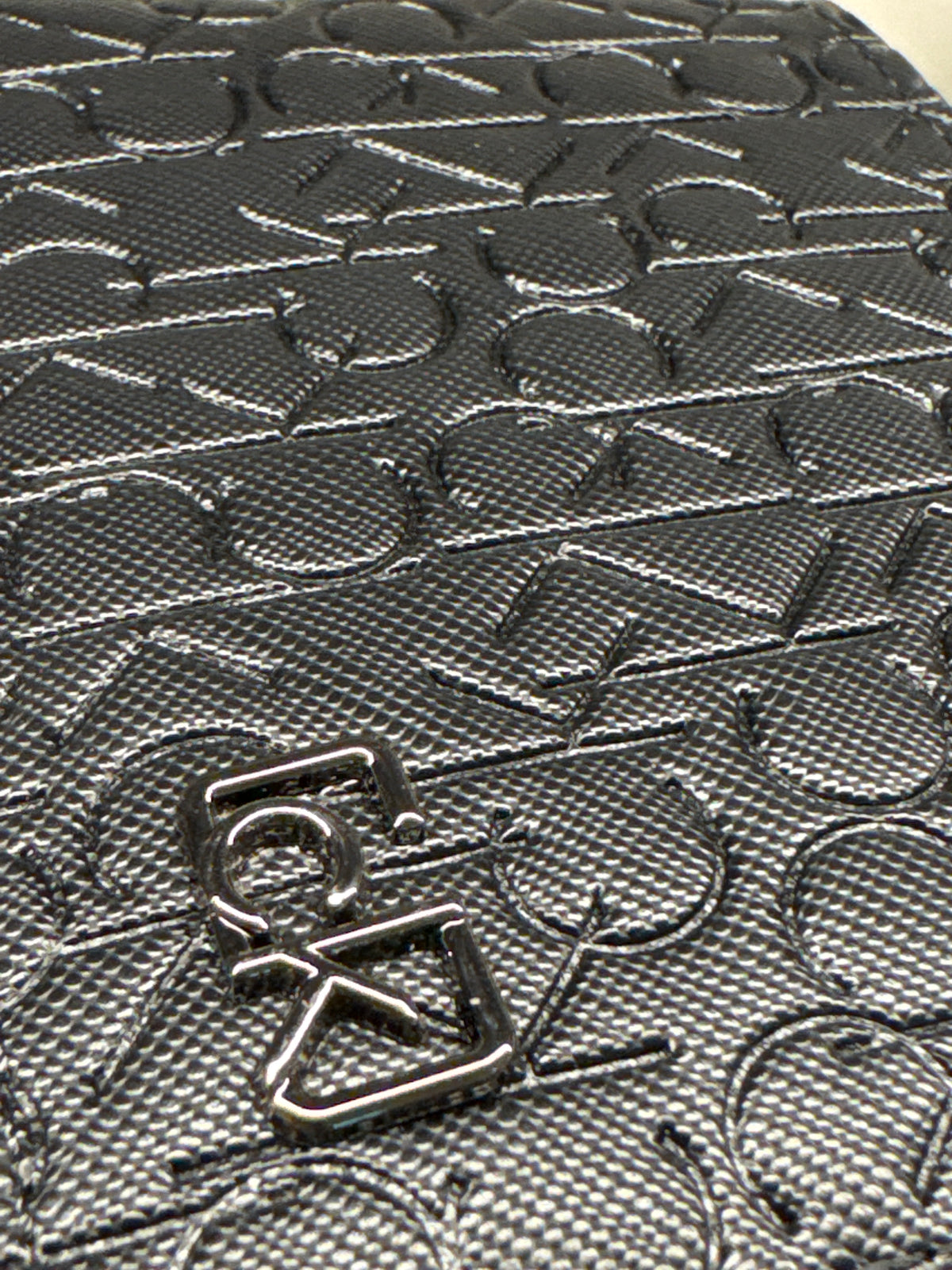 Black Embossed Monogram Leather Bifold Wallet with Gunmetal Plaque