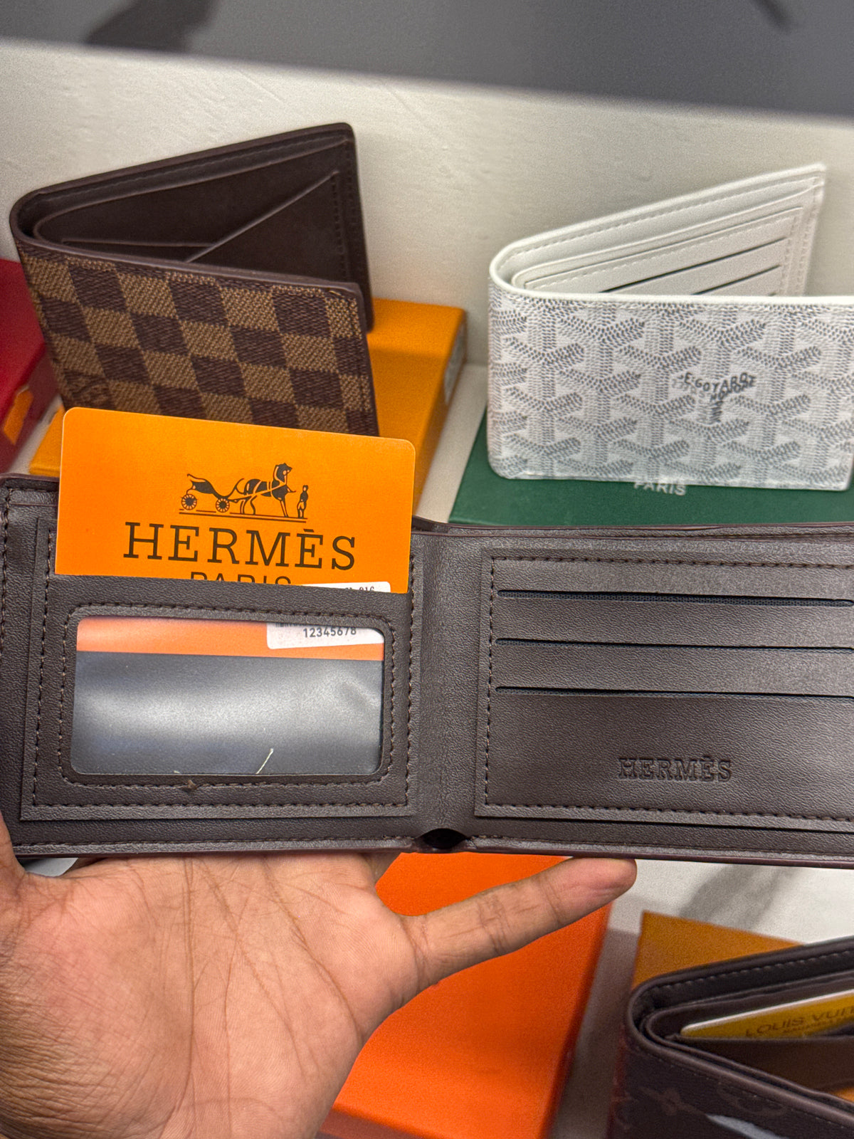Black Pebble-Grain Leather Bifold Wallet with Metallic Silver H-Logo Accent